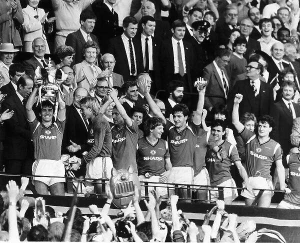 Manchester United Captain Bryan Robson lifts the FA Cup after beating Everton