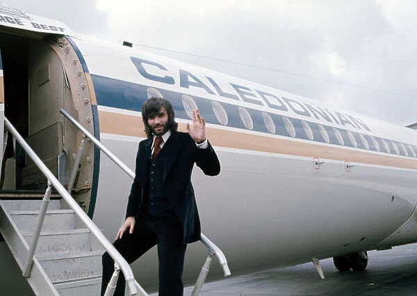 Manchester United footballer George Best waves before boarding his plane October