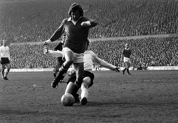 Manchester Uniteds George Best is challenge by Stoke defender March 1972