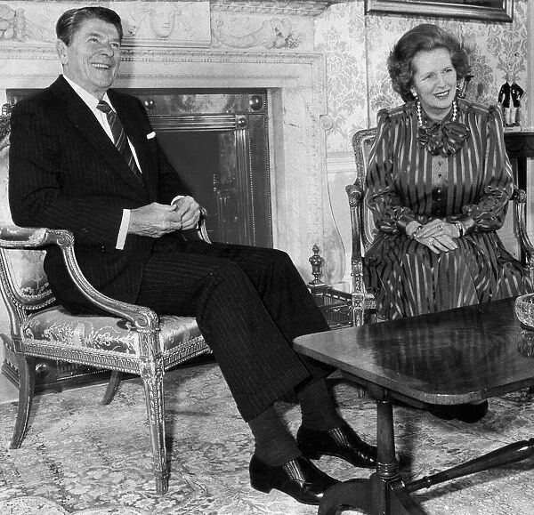 Margaret Thatcher and Ronald Reagan beside fireplace in Downing Street - June 1984
