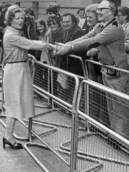 Margaret Thatcher shaking hands with fan during walkabout 08  /  05  /  1979