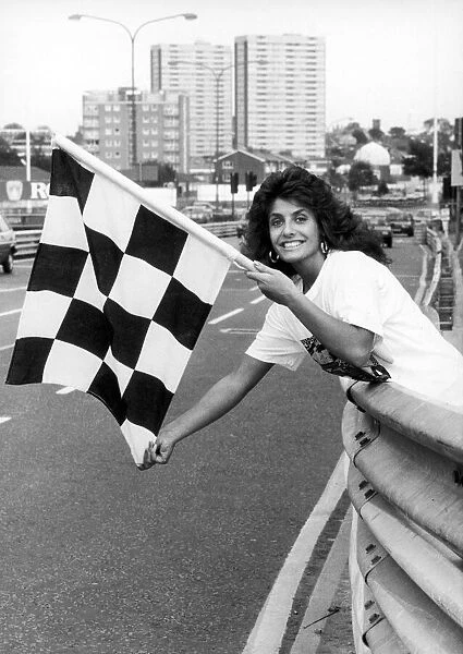 Maria Stevens, Beauty Queen, holding chequered flag at start of Halfords Birmingham Super