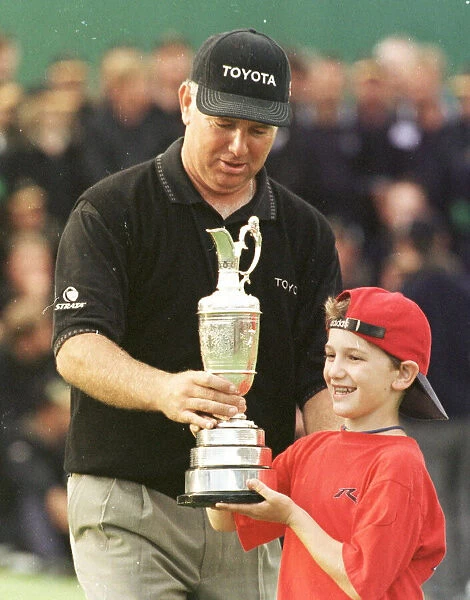Mark Omeara and son Shaun holding the Open trophy 1998 after winning the Open Golf