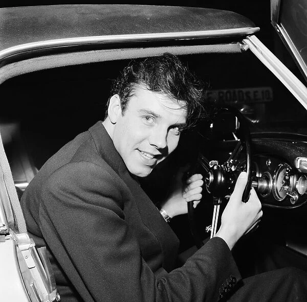 Marty Wilde singer, pictured sitting at wheel of motorcar, 12th February 1959