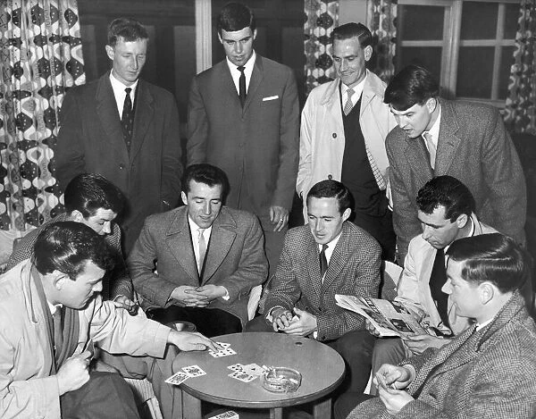 Members of the Birmingham City football team enjoying a game of cards before flying off