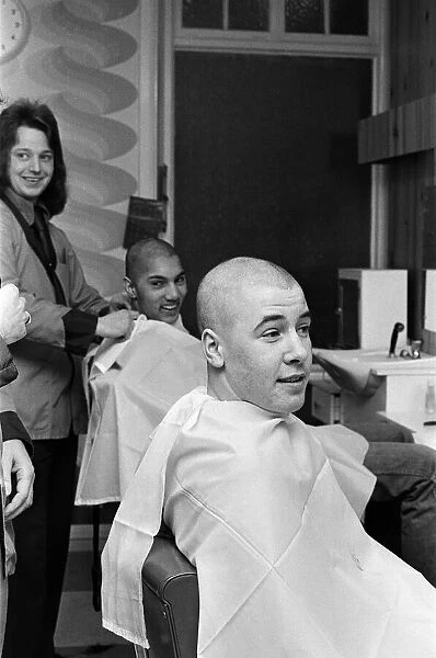 Two men getting 'Kojak'hair cuts. 1975