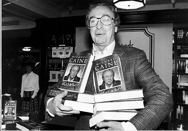 Michael Caine Actor with copies of his autobiography Whats It All About