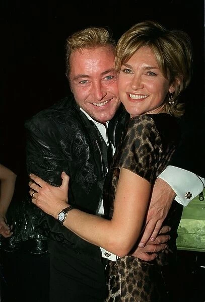 Michael Flatley Dancer March 98 With arms round tv prsenter Anthea Turner at
