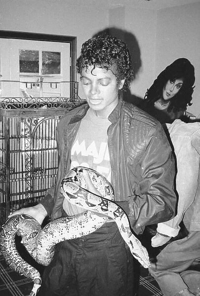 Michael Jackson seen here with Musles the boa constricter. September 1983