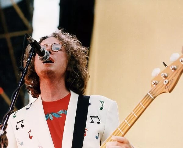 Mike Mills bass guitarist pop group REM on stage 1995