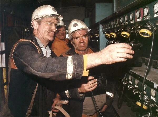 Miners Ron Oates (left) and Joe Olley hand in their lamps for the last time as Dawdon