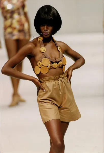 Model on the cat walk wearing a bra made from biscuits in the Red or Dead fashion show