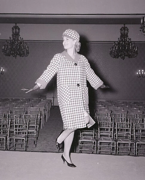 Model Judith Morgan November 1963 Wearing a checked design coat