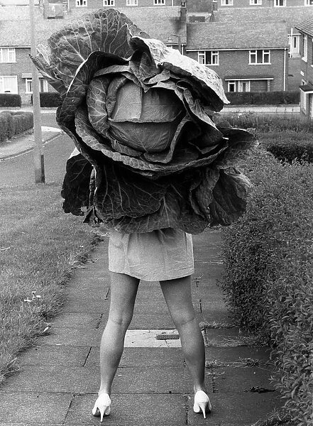 Model Ruth Charlton with a cabbage grown by Charlie Weatherspoon of Prudhoe in