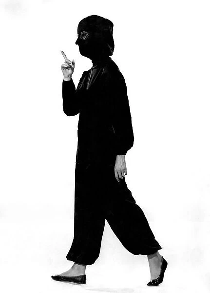 Model Valerie Gaten wearing pyjamas and matching headwear