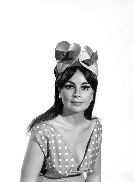 Model wearing a novelty valentines bonnet, 1966
