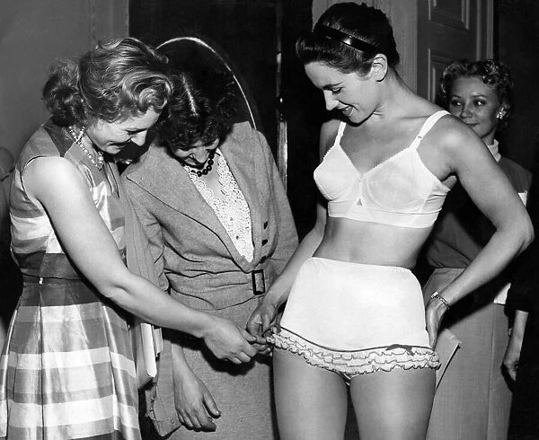 Models Irena Revels and Ludmilla Leveovil admiring underwear modeled by Joyce