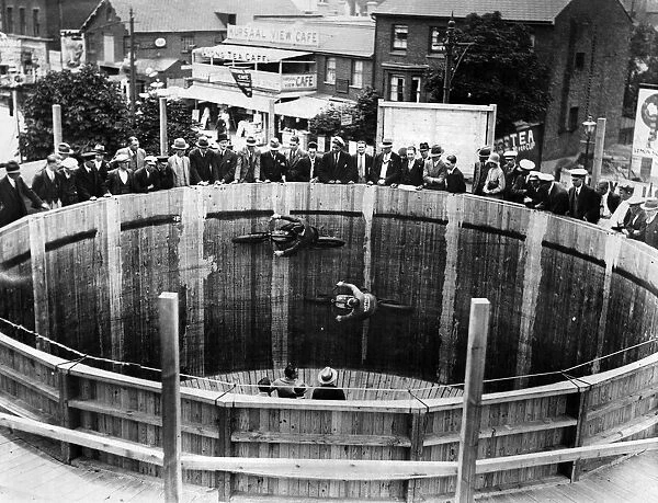 Two motorcycle riders in action on the wall of death, Southend. 26th June 1929