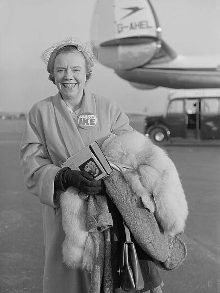 Mrs Eric Burt just stepping of the BOAC flight from the USA wearing '