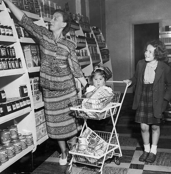 Mrs Freda Fox seen here selecting a jar of jam from the shelves of the new self service