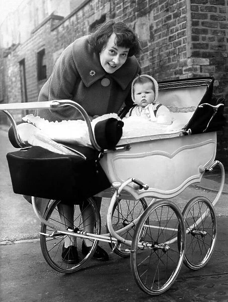 Mrs L jackson, of Cross Parade, with Susan in a pram which cost 5 on 23rd March 1961