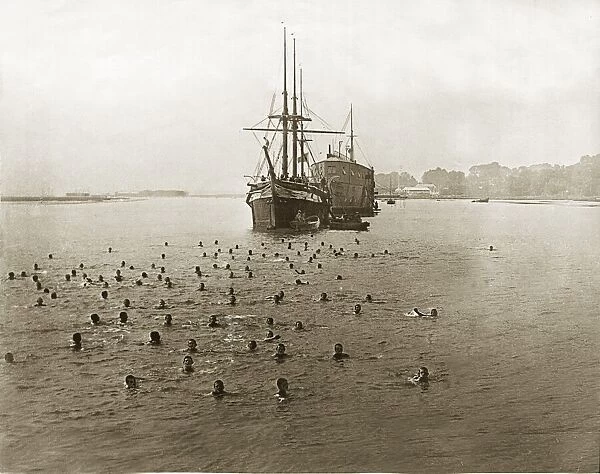 Naval cadets taking a swim around the Training ship Mercury a former Royal Navy ship of