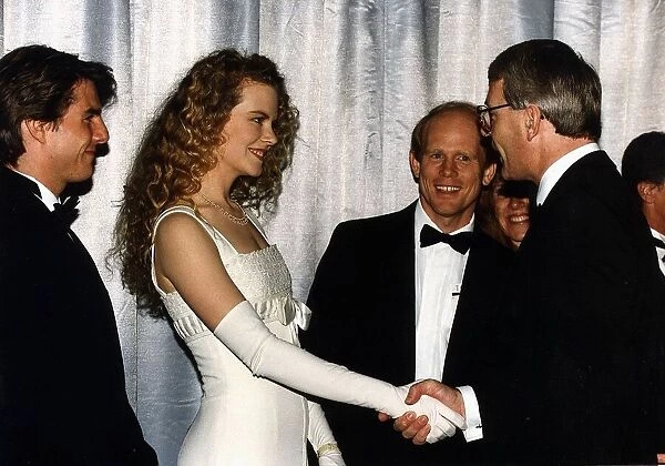 Nicole Kidman actress shakes hands with Prime Minister John Major at film premier of Far