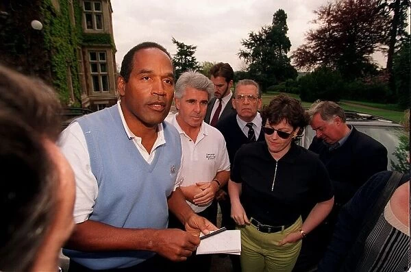 OJ Simpson signs some autographs during his game of golf