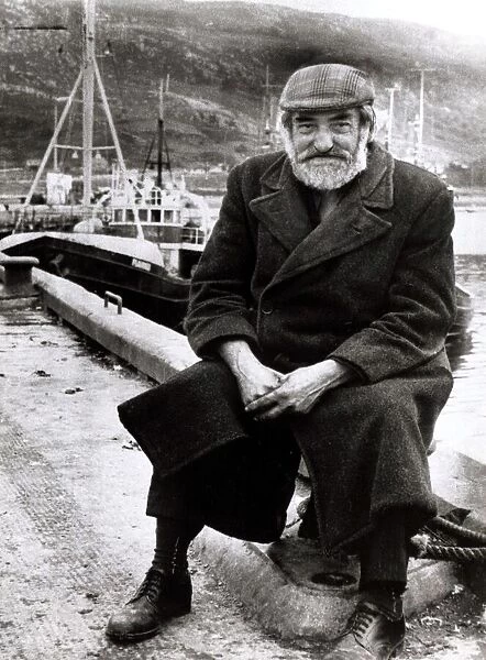Old Man sitting at harbour circa 1950