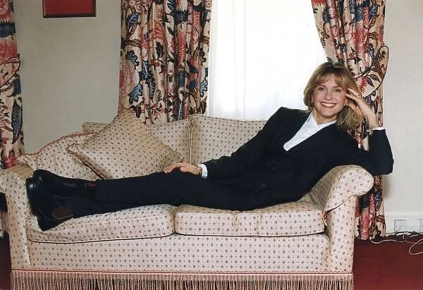 Olivia Newton-John smiling during interview in London hotel - January 1995