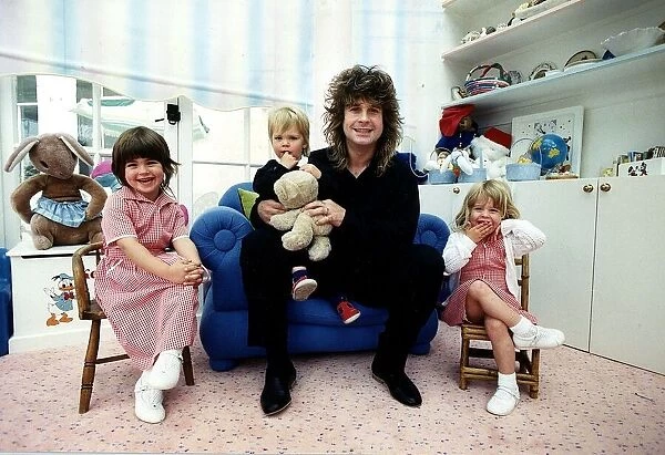 Ozzy Osbourne rock singer from the rock group Black Sabbath with his family May