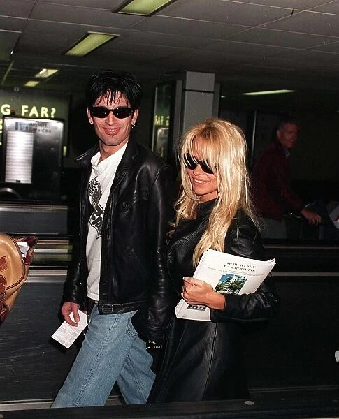 Pamela Anderson actress and husband rock star Tommy Lee arrive at Heathrow Airport after