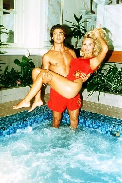 Pamela Anderson American Actress Being lifted by David Charvet her co-star in Baywatch