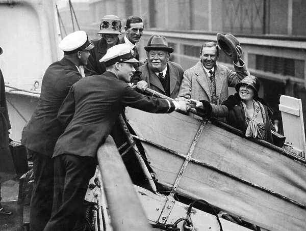 Five of the party of six Daily Mirror guests bidding goodbye to officers of the liner