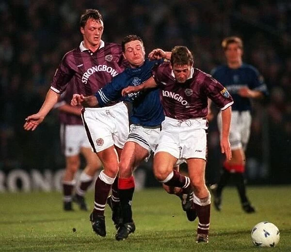 Paul Gascoigne is tackled by Steve Fulton and Gary Mackay Hearts Rangers Scottish