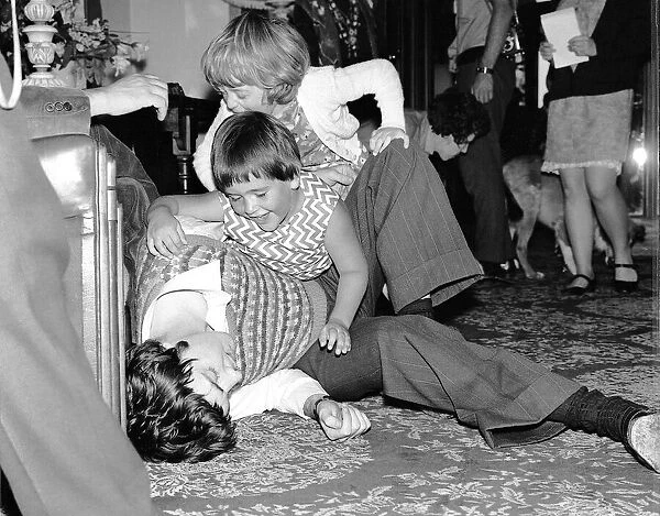 Paul McCartney relaxes with children during filming of Magical mystery tour September
