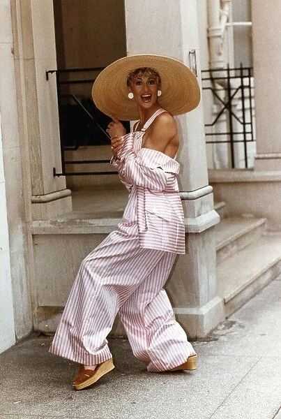 Paula Hamilton model wearing a pink and white striped silk jacket and dungarees