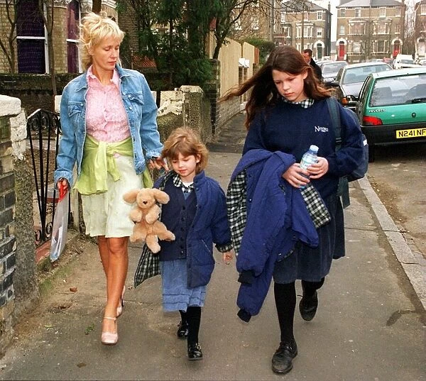 PAULA YATES WALKS TWO OF HER DAUGHTERS FIFI TRIXABELLE AND PEACHES TO SCHOOL TODAY