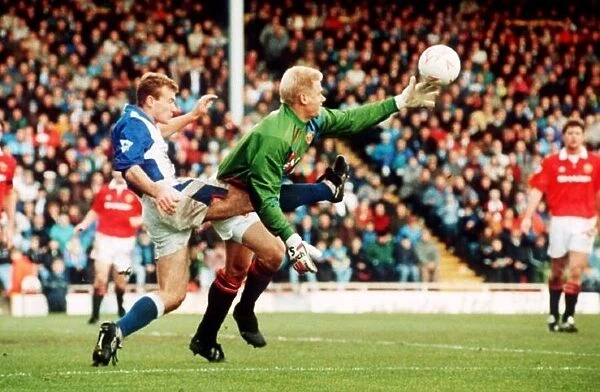 Peter Schmeichel Manchester United goalkeeper in a tangle with Alan Shearer of Blackburn