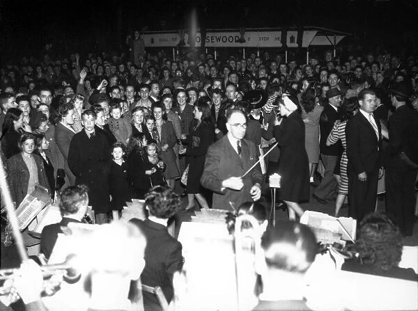 Bill Pethers and his Orchestra performing outside the Coventry Hippodrome Theatre on VE