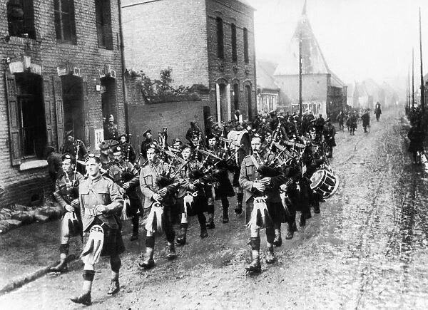 Pipers believe to be from the Cameron Highlander Regiment marching to the frontline