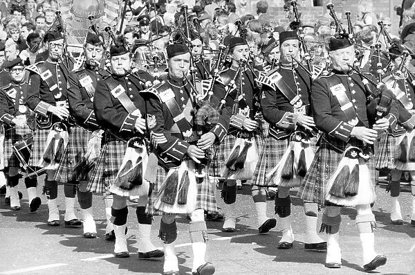 Pipers marching pas the Royal County Hotel in Durham during the Durham Miners Gala in