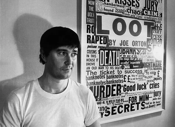 Playwright Joe Orton next to a promotional poster of his new play Loot