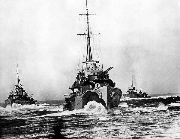 Ploughing steadily through the broken water, these destroyers of a British flotilla at