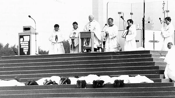 Priests to be ordained prostrate themselves before Pope John Paul II at Heaton Park