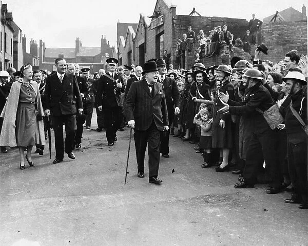 Prime Minister Winston Churchill greeted by enthusiastic crowds as he tours the bomb