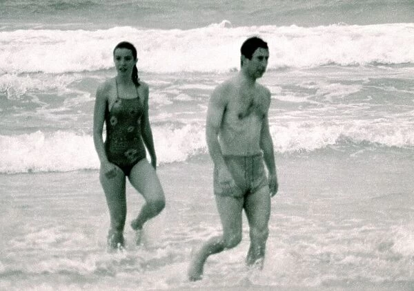 Prince Charles in Australia with unidentified woman. Walking out of the ocean