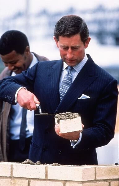 Prince Charles lays a brick at start of a housing scheme September 1988