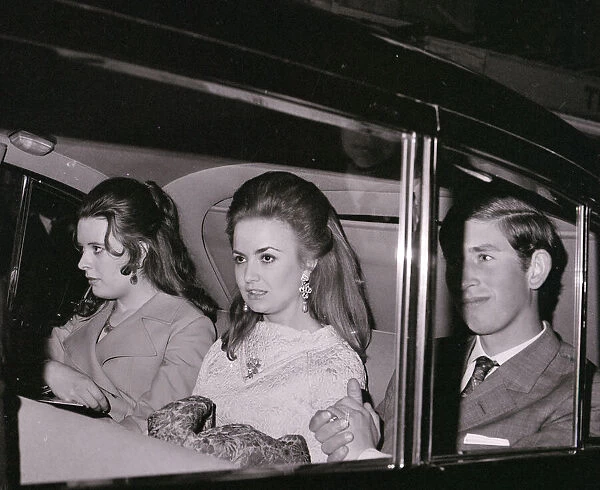 Prince Charles with Lucia Santa Cruz (centre) in car on theie way to the Fortune Theatre