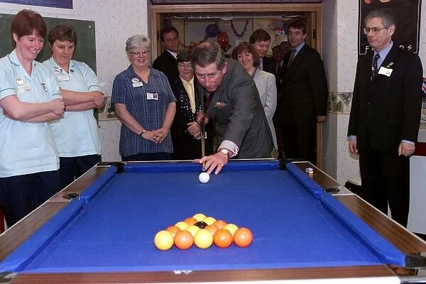 Prince Charles plays pool as he visits North Derbyshire Hospital in Calow February